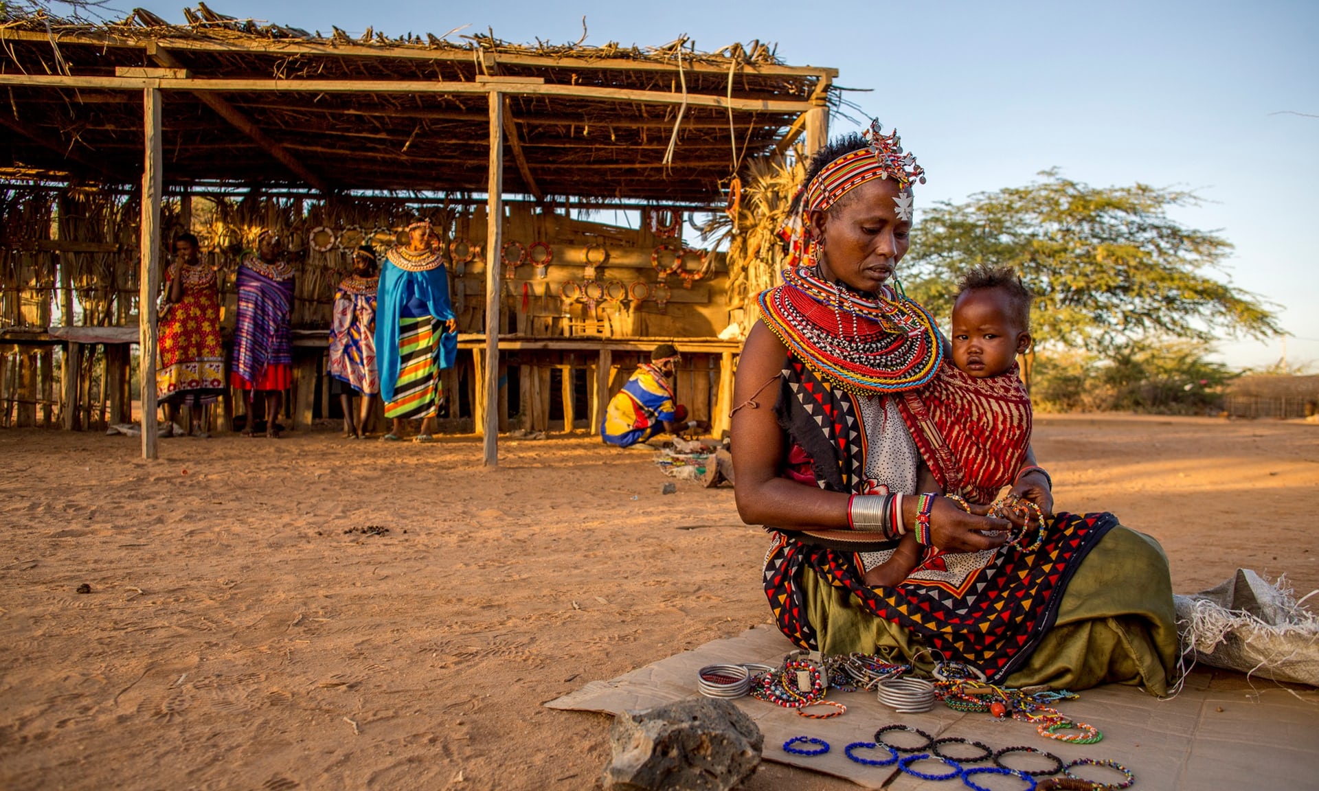 Umoja women make jewellery to sell to tourists. Here, China Laprodati with her baby is selling her jewellery to visitors.
