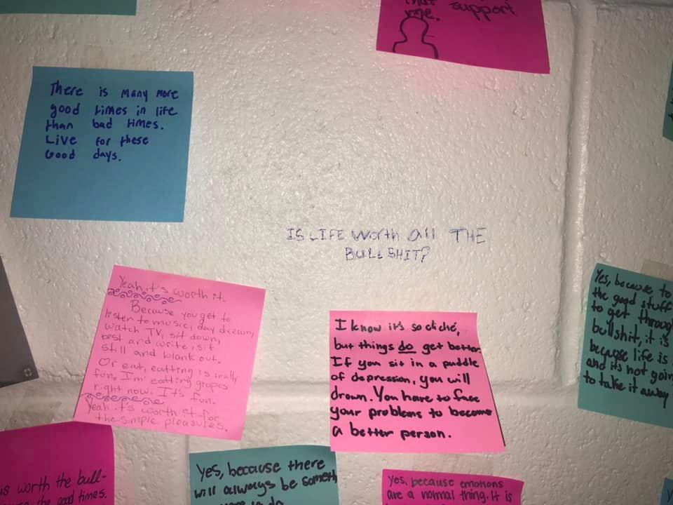 ‘I walked into the bathroom today during my 3rd period english class and when i saw this my jaw dropped. somebody wrote on the wall “is life worth all the bullshit?” we see these things written on walls and our first reaction is “well let’s wash it off that’s vandalism” but some people took the time out of their day to write on sticky notes about why their life is worth it. This absolutely made my day and gave me a little more hope for our generations happiness. it really shows how much love can be shared by a small act of kindness. i think we can all work on a small act of kindness everyday, i’m writing my sticky note right now?how about you? #spreadawareness #suicideprevention