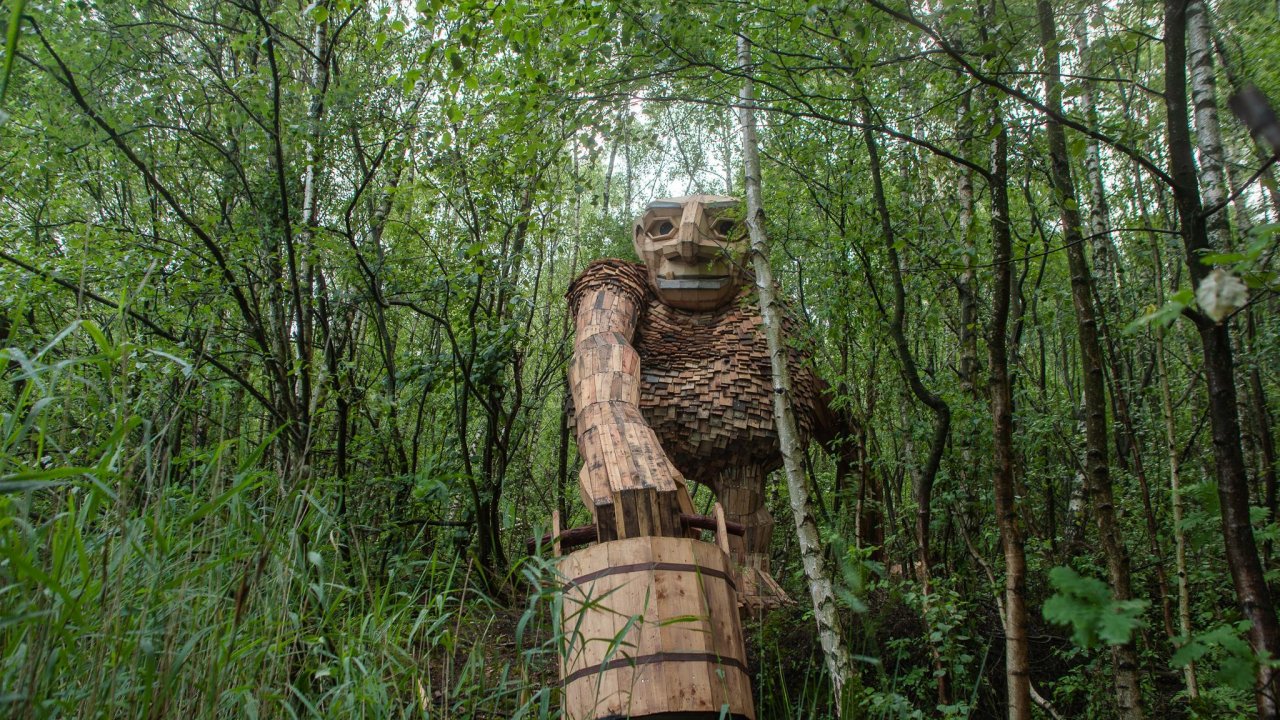 Artist Hides Giants Made from Recycled Wood In The Forests Of Belgium