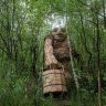 Artist Hides Giants Made from Recycled Wood In The Forests Of Belgium