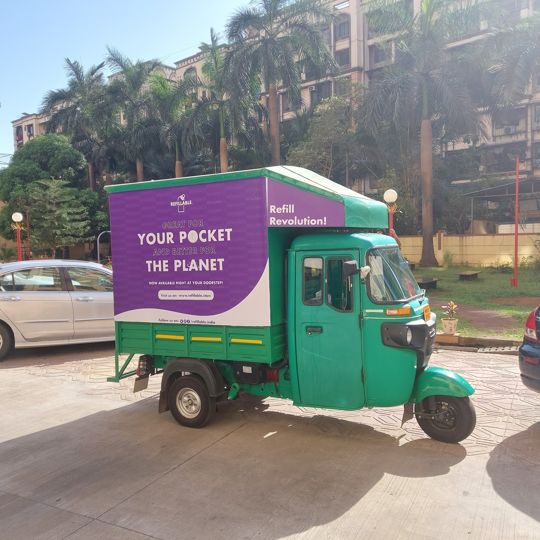 A tuk-tuk retrofitted with a refill machine dispenses various types of floor cleaners, sanitisers, handwashes, and laundry detergents.