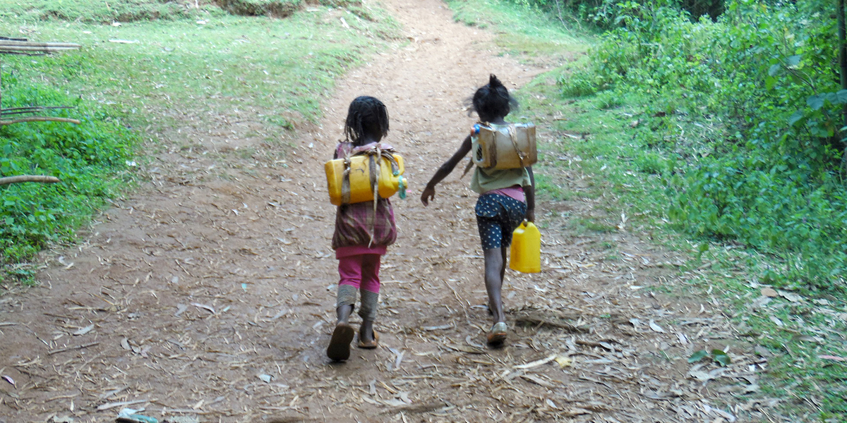 Women and children walk several kilometres every day in order to bring back to their village water from questionable sources.’