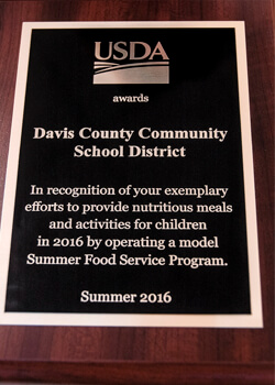 The United States Department of Agriculture bestowed the Davis County Community School District with an award recognising the district’s successful summer food program.