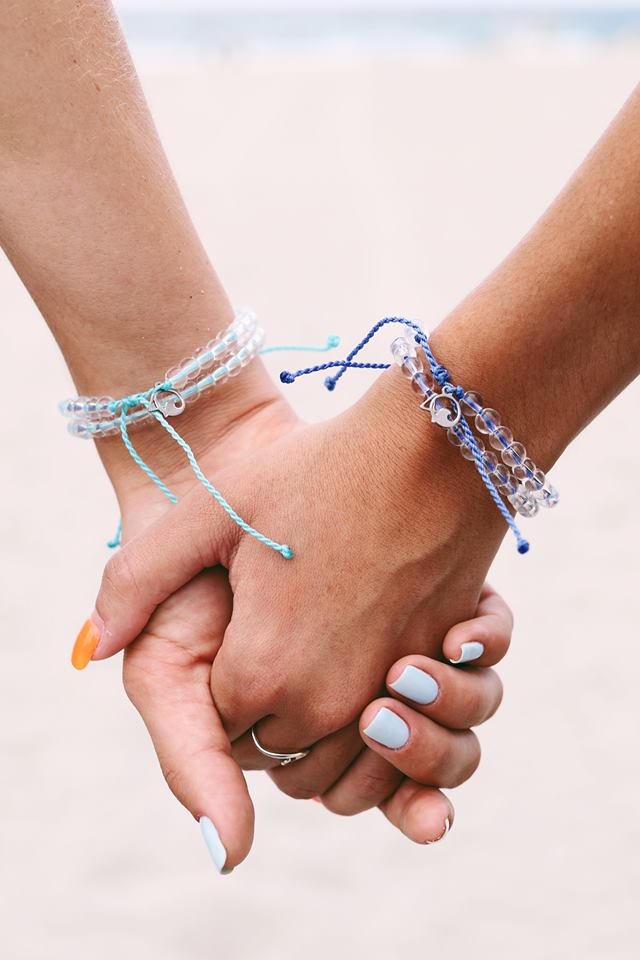 The bracelet is made from 100% Recycled Materials. The beads are made from recycled glass bottles & the cord is made from recycled plastic water bottles. Every bracelet purchased funds the removal of one pound of trash from the Ocean.