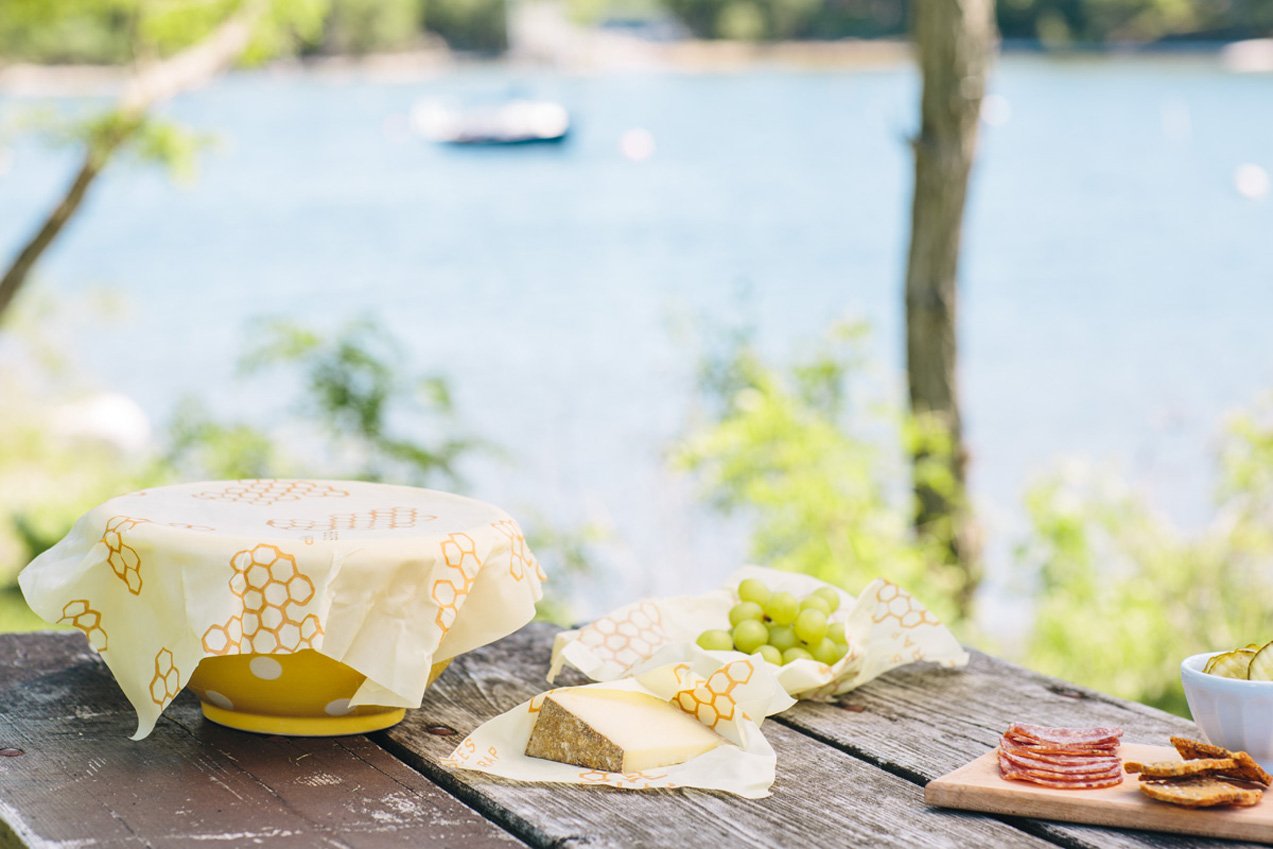 Wrap cheese, half a lemon, a crusty loaf of bread, and fruits and vegetables. Cover a bowl, or pack a snack for your next adventure. Made with organic cotton, beeswax, organic jojoba oil, and tree resin. Bee’s Wrap is washable, reusable and compostable.
