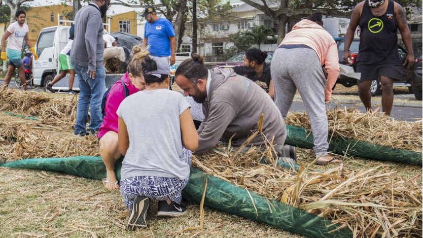 Mauritians were making booms to float on the sea out of sugar cane leaves, plastic bottles and hair that people were voluntarily cutting off.