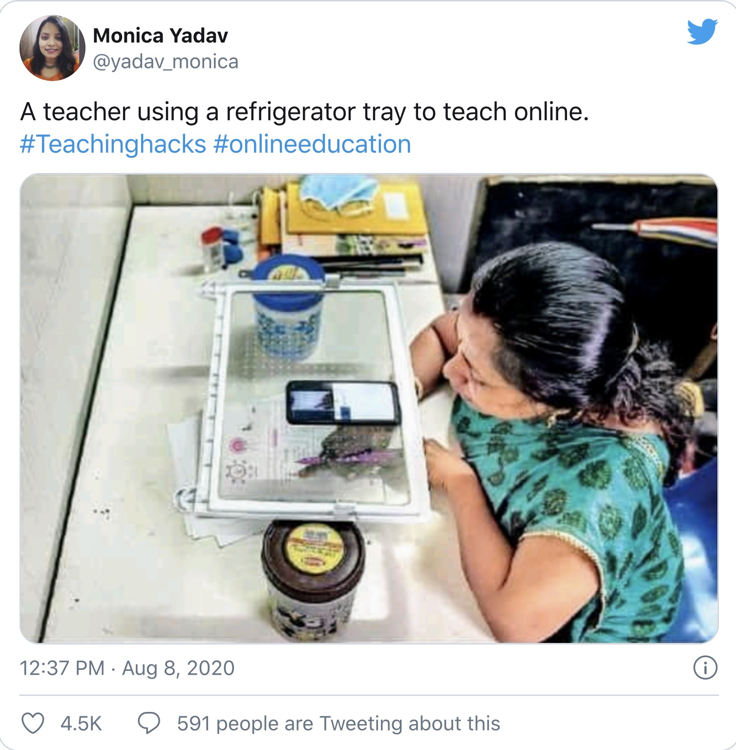 A Twitter user took to the microblogging platform to share a picture of a teacher using a transparent refrigerator tray for her online class. After balancing the tray on two containers, she put her smartphone on top of it and was photographed solving a problem on a piece of paper kept on the table below. The innovative hack, which removed the need for her to hold her phone in one hand and also allowed students to view the problem as she solved it, has been widely lauded on social media.