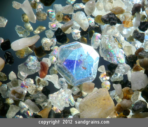 Sand from Japan contains what looks like a sapphire crystal (magnified 150 times)