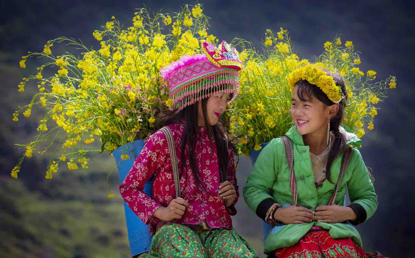 In another heartwarming photo from Vietnam, photographer Nguyen Huu Thong captured two young girls smiling at each other as they sat side by side, carrying on their backs huge baskets filled with yellow flowers. “They had spent the afternoon picking these beautiful flowers that would be used for medicinal purposes in their tribe,” said the photographer. “Their lovely faces and beautiful smiles made me appreciate the moment.”