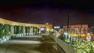 Abandoned Hollywood hotel transformed into solar-powered homeless shelter including rooftop farm