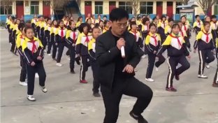 Chinese school principal shuffle dances with students during break