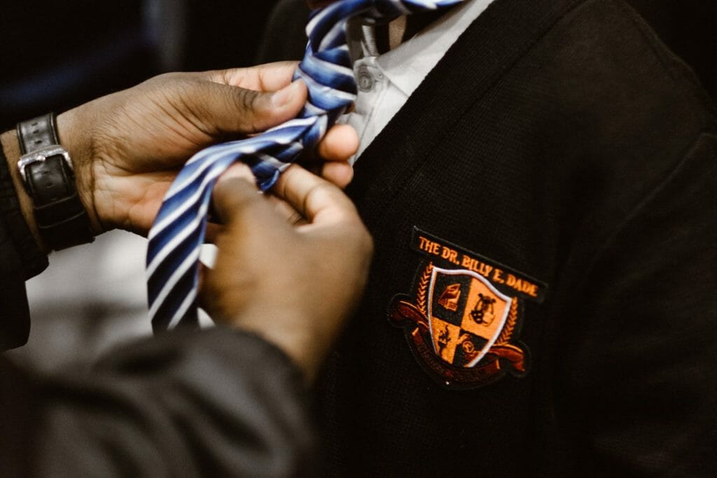 He spoke of learning how to tie a tie as a rite of passage some young men never experience. Mentors handed out ties to the eager students and helped them perfect their half-Windsor knot.