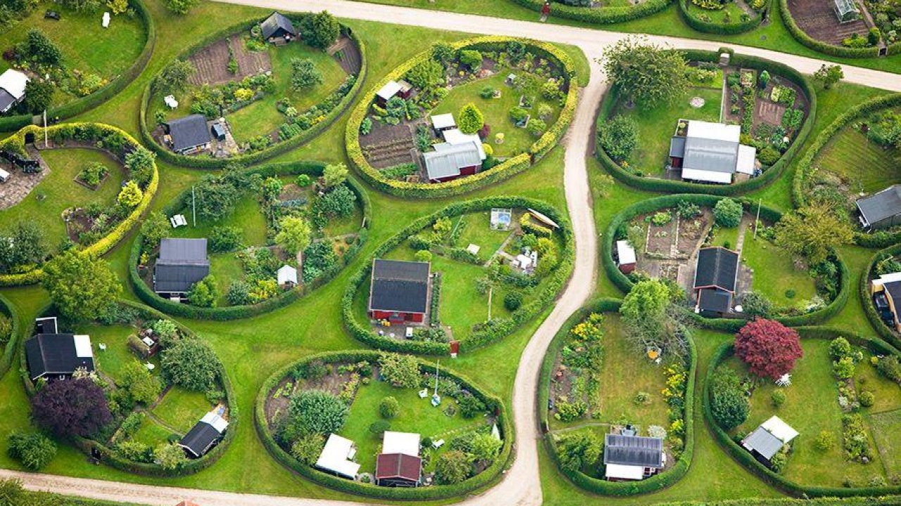 The Story Behind The Unique Oval Community Gardens of Copenhagen