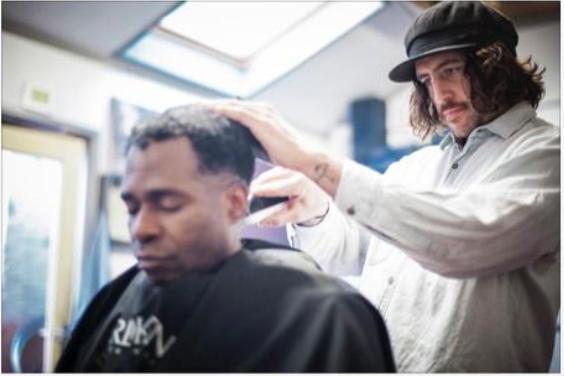 This barber cuts at homeless shelters