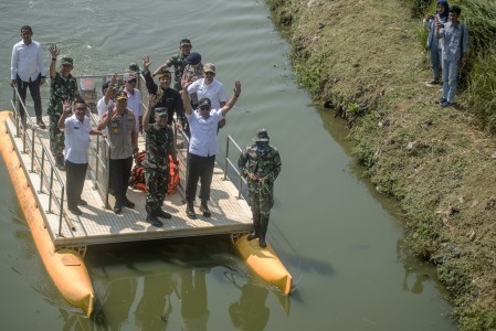 West Java Governor Ridwan Kamil (second right) along with Siliwangi Military commander Maj. Gen. Besar Harto Karyawan (center) and West Java Police chief Insp. Gen. Agung Budi Maryoto (second left) inspect the Citarum River in Bojongsoang, Bandung regency, West Java, on Sept. 26, 2018.