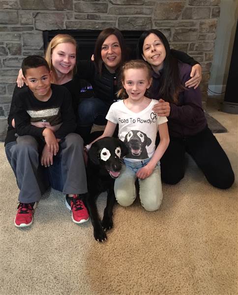 Niki Umbenhower with Rowdy, Julie Brown, Ava, 10, Stephanie Adcock, and Carter, 8 – In March, both children and their mothers visited Rowdy. Adcock says seeing her son with the dog was an overwhelming experience.