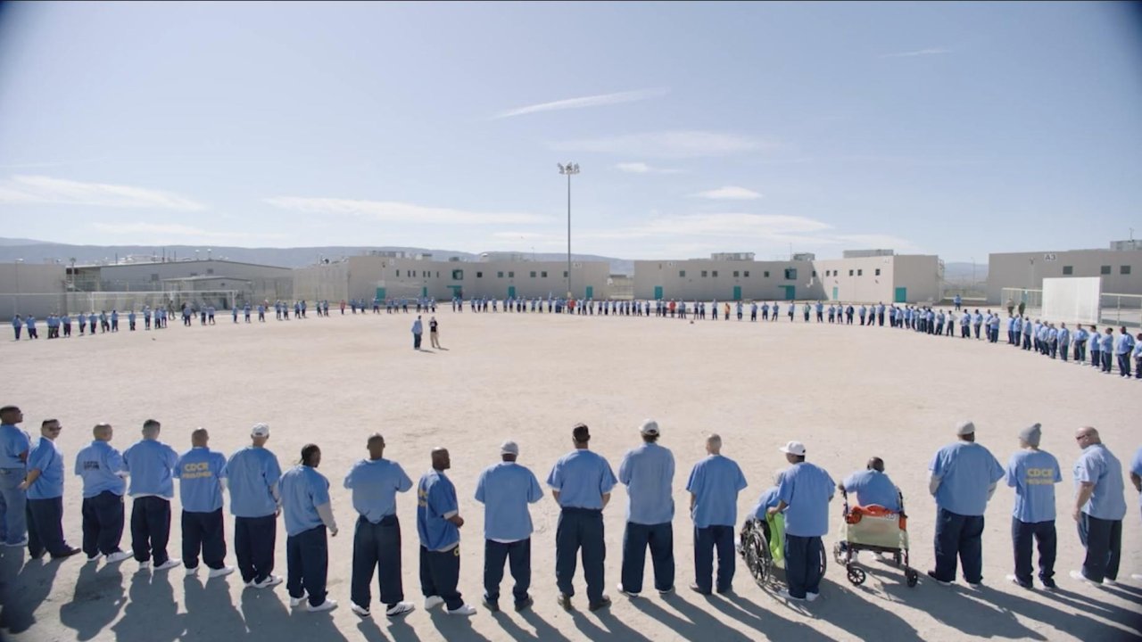 As 235 inmates close in on a woman in the prison yard, what they (and we) learn is heartbreaking