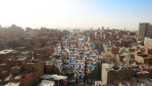 This mural spanning 50 buildings in Cairo contains a hidden message