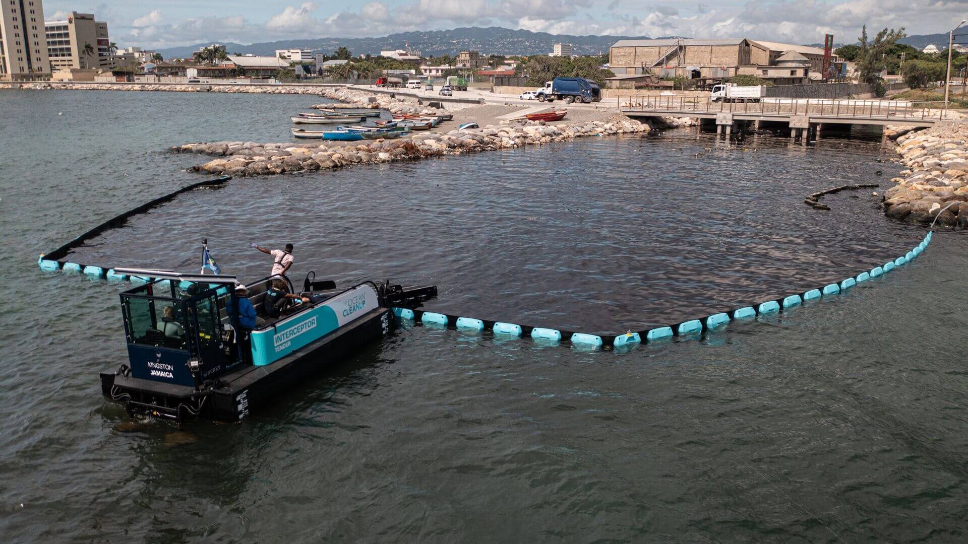 The Interceptor Barrier can be used to halt debris at the mouth of small rivers canals, and the Interceptor Tender comes along and uses a conveyor belt to scoop up the trash trapped in them.