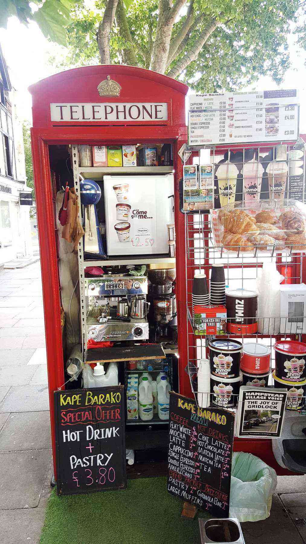 On Hampstead High Street in North London, the family-run Kape Barako coffee kiosk may look tiny, but it packs a lot into a small space. The miniature café serves strong espresso drinks, tea, cakes, milkshakes, sandwiches, and pastries, and has gained quite a cult following since opening last year. It’s obviously standing room only though.