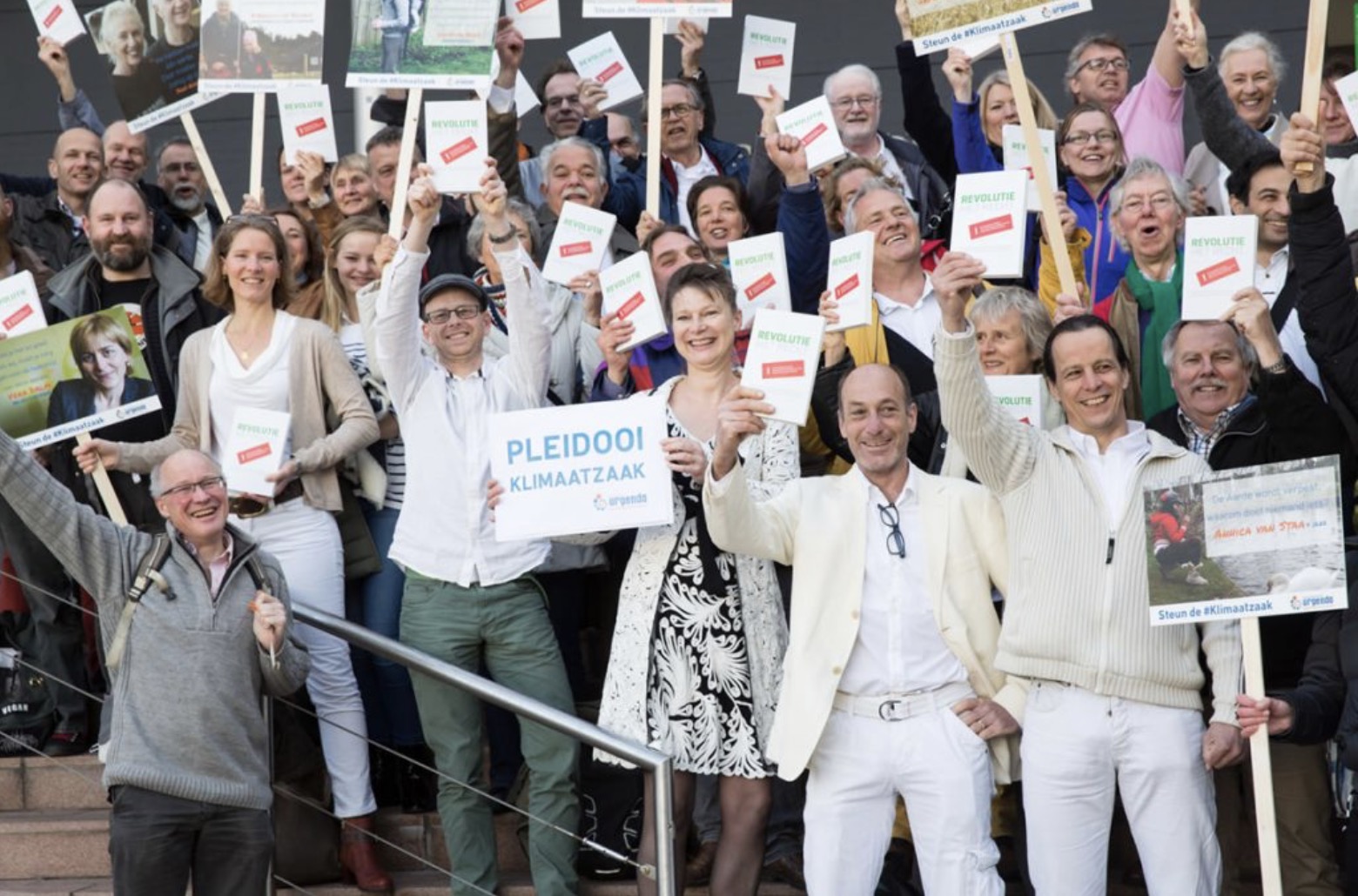 On 20 December 2019 the Dutch Supreme Court states that the Dutch government must reduce emissions immediately in line with its human rights obligations. Happy campaigners celebrate the ruling on the steps of the court. A historic victory for climate justice