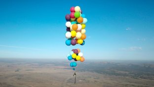 Englishman flies over South Africa in a cheap camping chair tied to 100 balloons