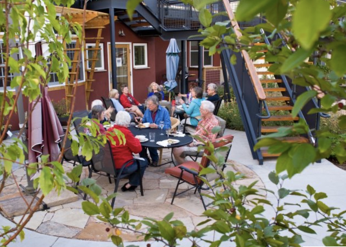 Co-housing is community designed to foster connection. Physical spaces allow neighbors to easily interact with others just outside private homes. Common areas including kitchen, dining space and gardens bring people together. Collaborative decision-making builds relationships.
