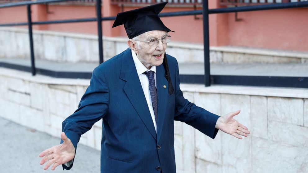 Giuseppe Paterno, 96, Italy's oldest student, celebrates after graduating from his undergraduate degree in history and philosophy during his graduation at the University of Palermo, in Palermo, Italy, July 29, 2020.