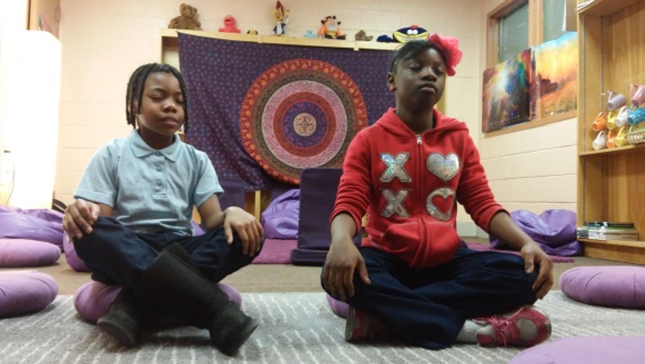 The Mindful Moment Room is filled with lamps, decorations, and plush purple pillows. Misbehaving children are encouraged to sit in the room and go through practices like breathing or meditation, helping them calm down and re-center. They are also asked to talk through what happened.