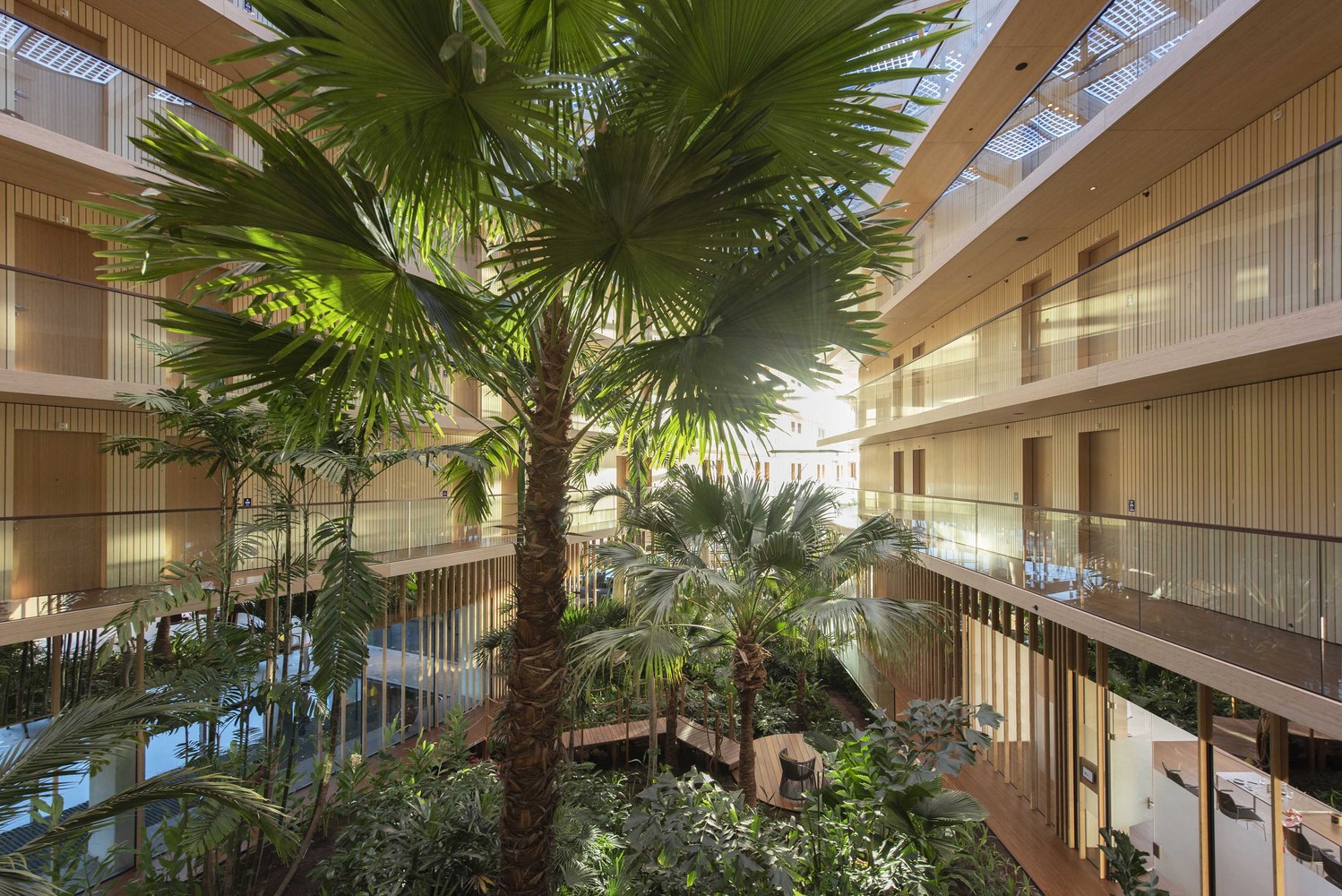 The FSC and PEFC-certified wood selected for the beams, the columns, the ceilings and the frames was left in an unfinished state, leaving the majority of its walls and ceilings raw and unadorned – this in turn revealing the complex structure of the building. The architecture team from the SeARCH firm also barred any material with a short life cycle, or those that couldn’t be recycled or dismantled and reused at some point.