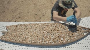 This surfboard is made from 10,000 cigarette butts