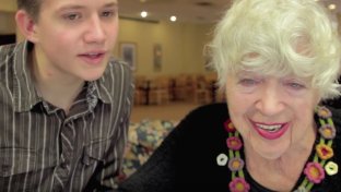 Try not to smile while watching these kids teach elderly people about computers
