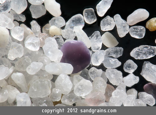 These tiny grains of sand have eroded over hundreds of millions of years and their original crystal shape is not longer seen (magnified 100 times).