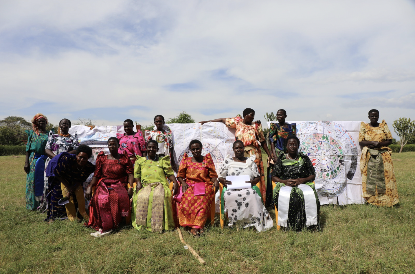 Bagungu women gather to display eco-cultural calendars produced through intense community dialogues. Photo: Hannibal Rhoades.