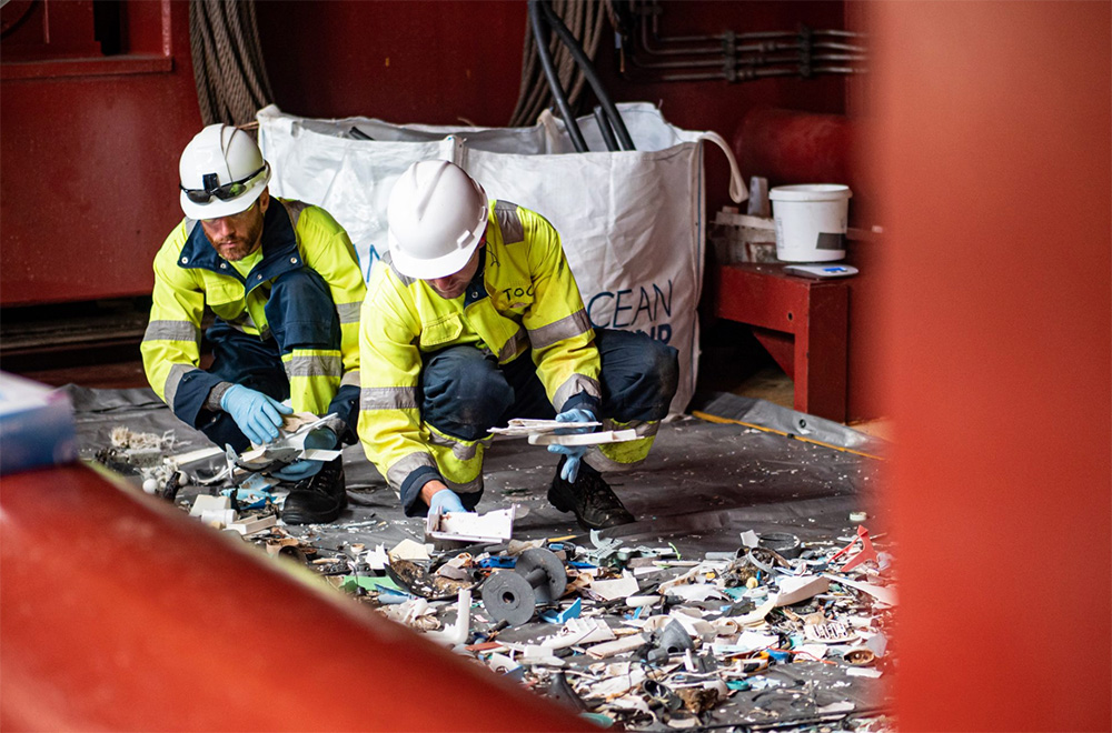 The group thinks a ship could visit the garbage patch every few months and tow the debris that the array catches to shore. But right now, The Ocean Cleanup's staff removes the plastic the device catches from the water by hand, using nets.