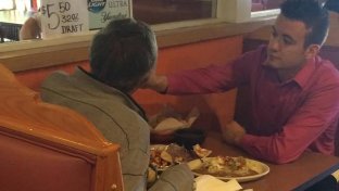 Waiter spoon feeds man without hands. He has an important message for us.