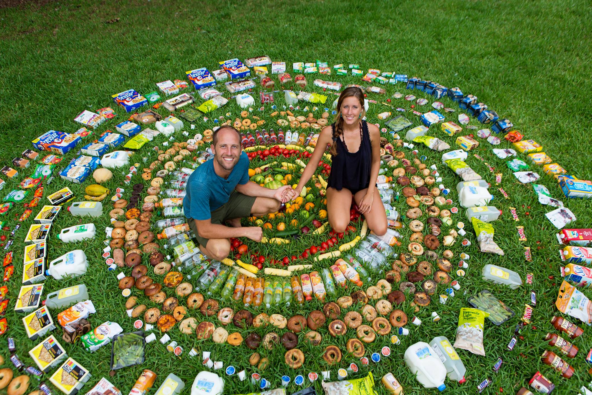 ‘Would you believe that every single piece of food you see here came from a dumpster? Mind blowing, but this is actually nothing. We throw away nearly half of all food produced in America which is about $165 billion worth! All while 50 million Americans are food insecure or hungry!’ — Rob Greenfield, pictured with Cheryl Davies.