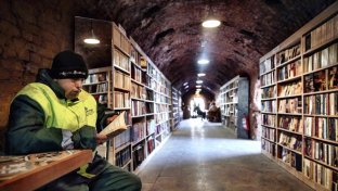 Turkish refuse workers create popular library from books they salvaged from the trash